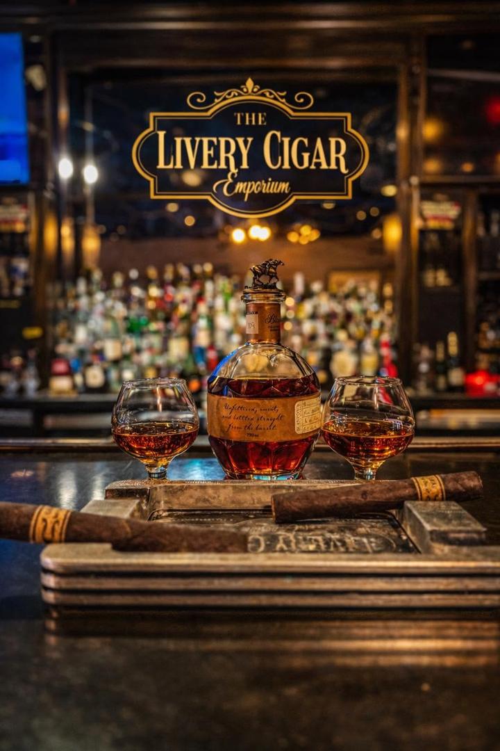 Whiskey and cigars arranged at The Livery bar