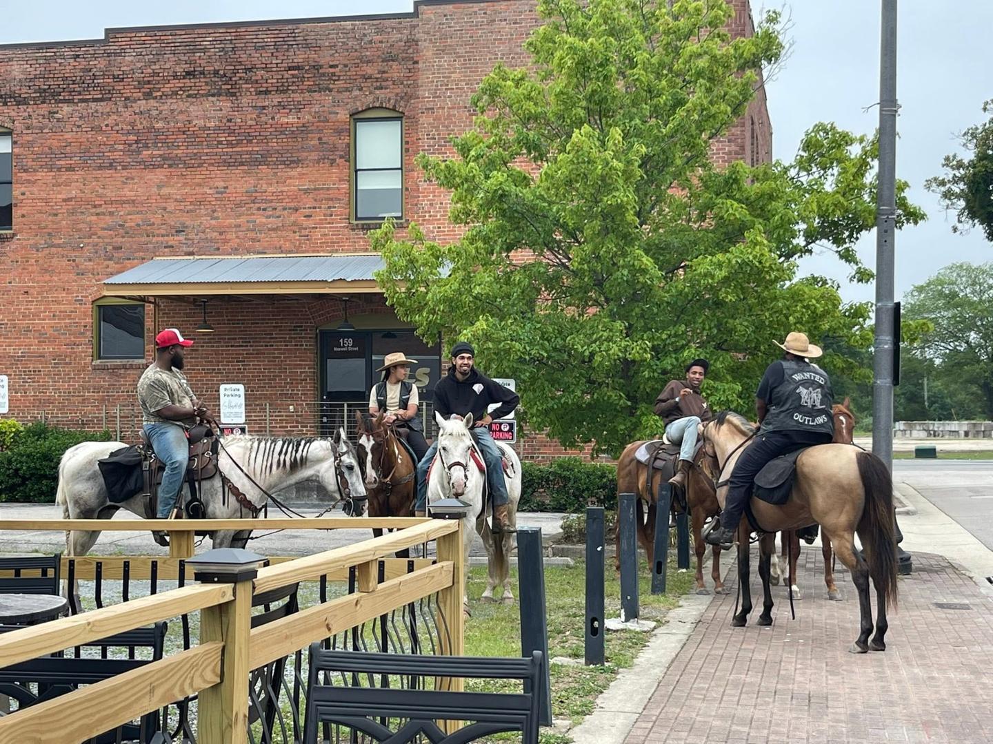 Horseback riders gathering in The Livery community